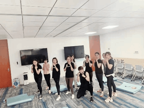 a-group-of-people-posing-for-work-for-fitness